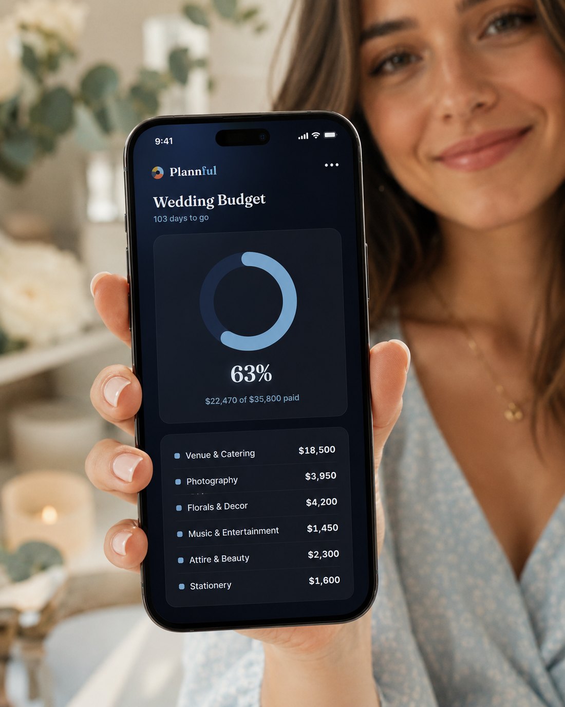 A woman checking her Plannful wedding budget on an iPhone
